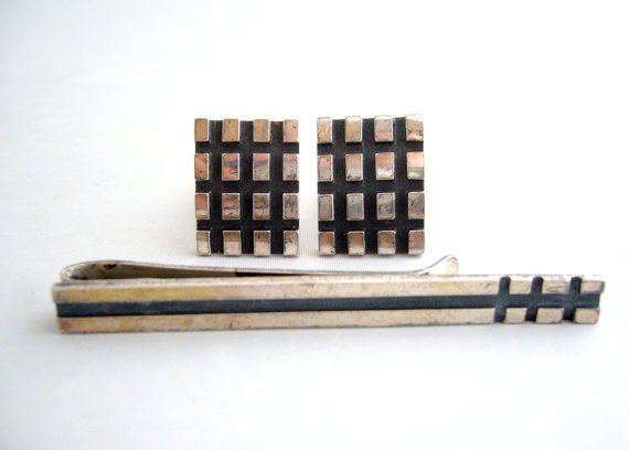 Sterling silver grid cufflinks and tie bar: Sterling silver grid cufflinks and tie bar, 1950s. Cufflinks 5/8" H x 3/4" W. Tie bar 2 1/2" W.