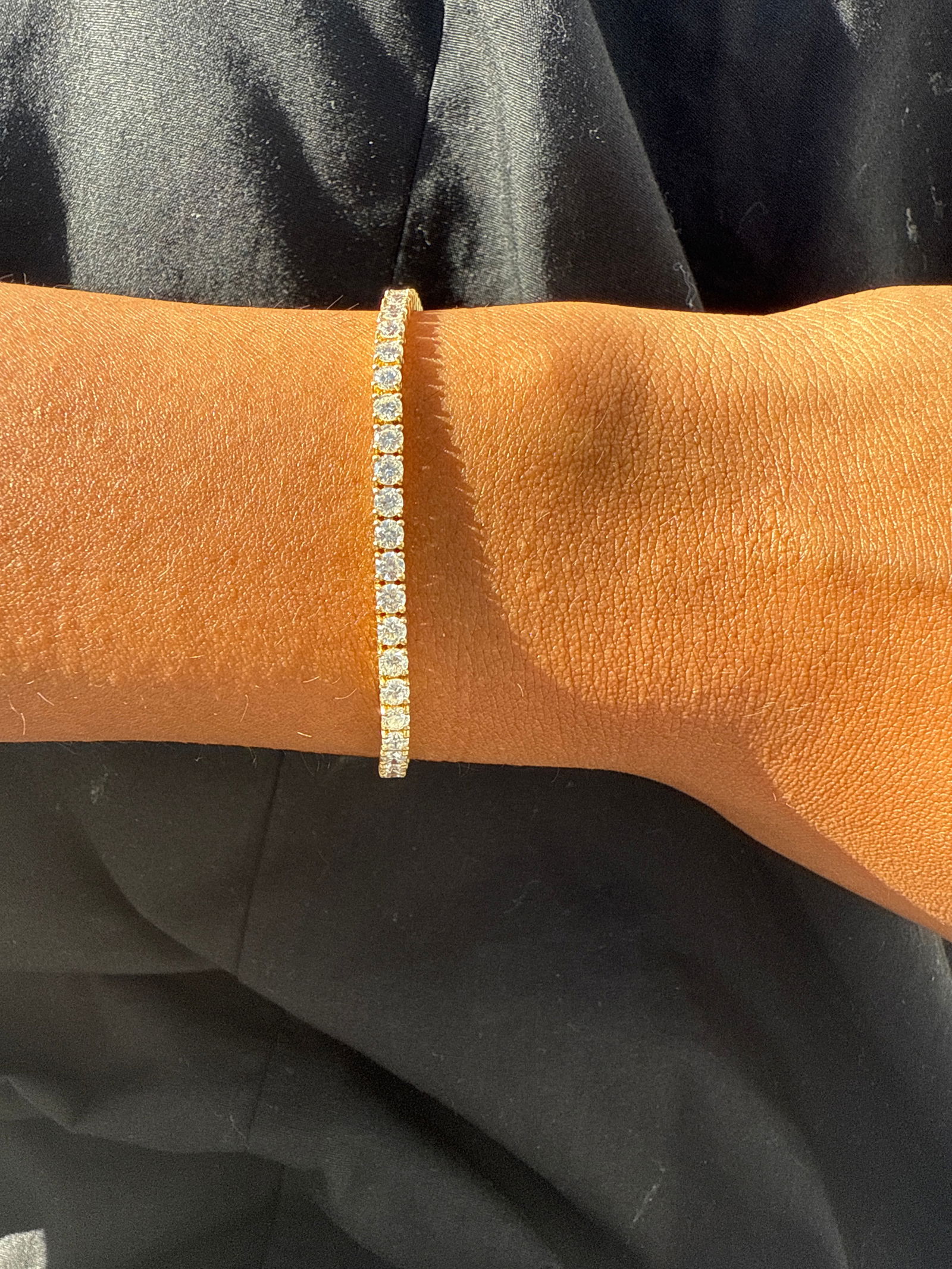 5 Carat Round Diamond tennis bracelet in 14k Yellow Gold: 14k Yellow Gold 5 Carat Diamond tennis Bracelet/Length of the Bracelet: 7 Inches/Total Diamond Weight: 5 Carat in a 7 inch bracelet/Solid 14K Yellow Gold and Conflict free Lab grown Diamonds/Diamond Q