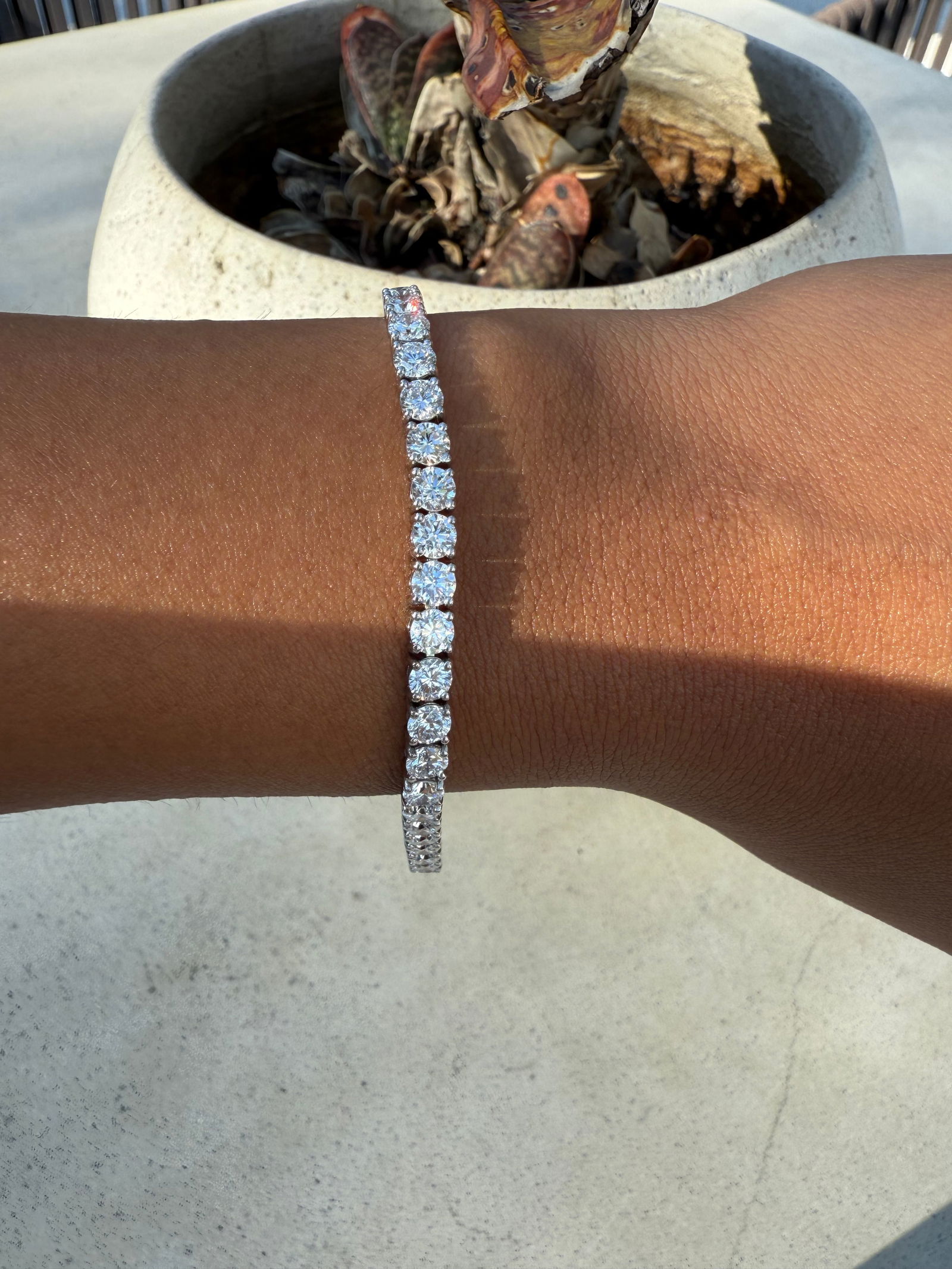 9 Carat Round Diamond tennis bracelet in 14k White Gold: 14k White Gold 9 Carat Diamond tennis Bracelet/Length of the Bracelet: 7 Inches/Total Diamond Weight: 9 Carat in a 7 inch bracelet/Solid 14K White Gold and Conflict free Lab grown Diamonds/Diamond Qua