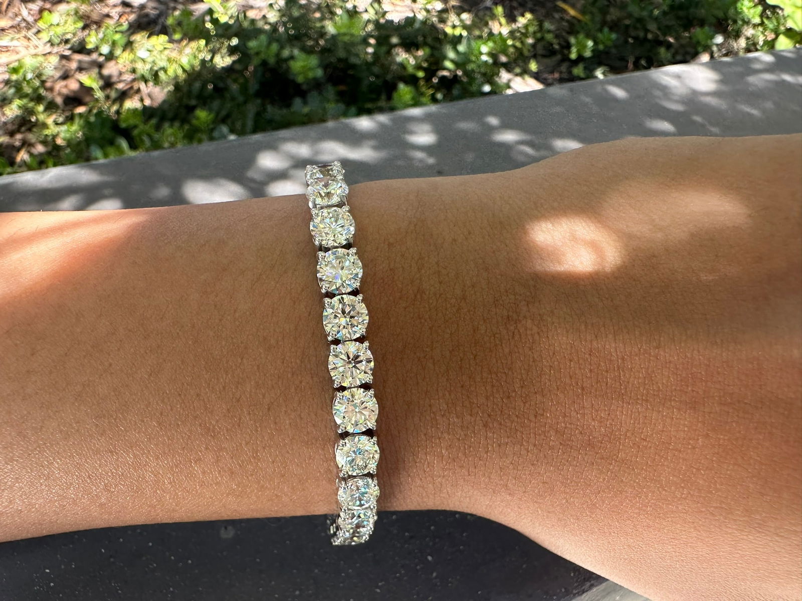 15 Carat Round Diamond tennis bracelet in 14k White Gold: 14k White Gold 15 Carat Diamond tennis Bracelet/Length of the Bracelet: 7 Inches/Total Diamond Weight: 15 Carat in a 7 inch bracelet/Solid 14K White Gold and Conflict free Lab grown Diamonds/Diamond Q