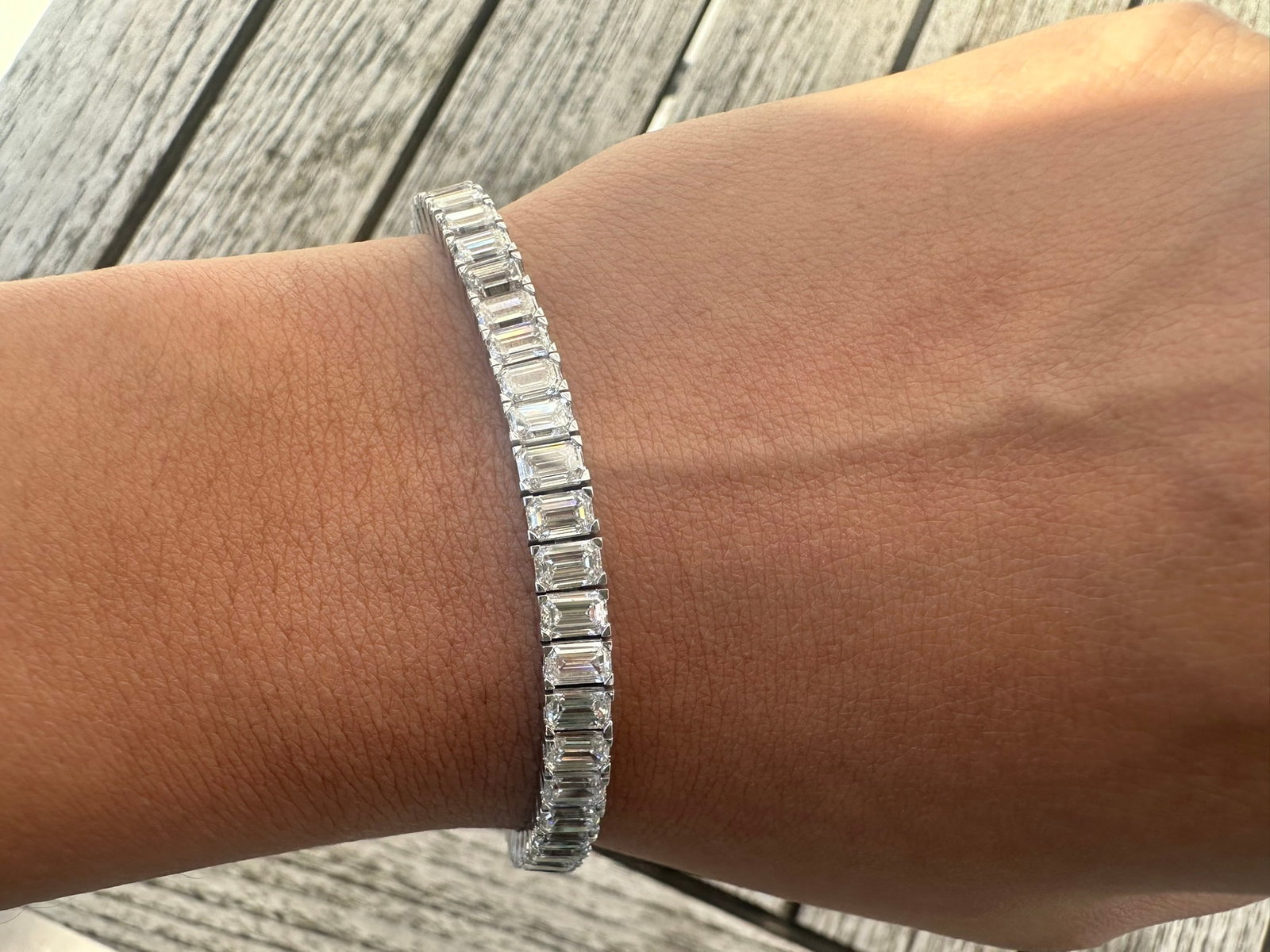 14 Carat Emerald Cut Diamond tennis bracelet in 14k White Gold: 14 Carat Emerald Cut Diamond tennis Bracelet/Length of the Bracelet: 7 Inches/Total Diamond Weight: 15 Carat in a 7 inch bracelet/Solid 14K White Gold and Conflict free Lab grown Diamonds/Diamond Qual