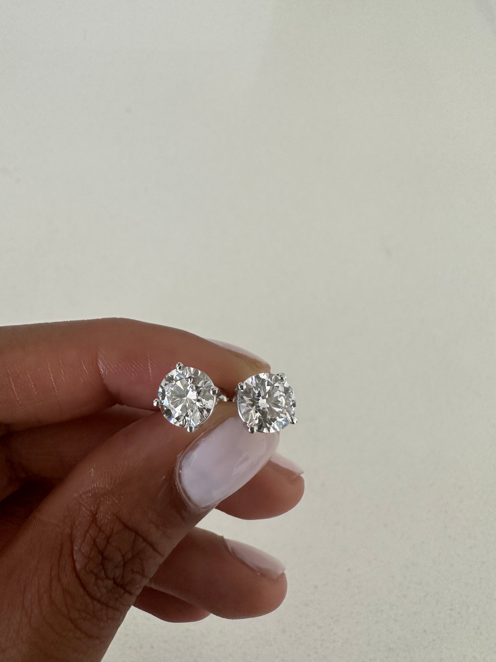 2 Carat Round Diamond Stud Earrings in 14k White Gold: 14k White Gold Diamond Stud Earrings/Total Diamond Weight: 2 CaratSolid 14K White Gold and Conflict free Lab grown Diamonds/Diamond Quality: E In Color & VVS-VS In Clarity/Width: 6.5 mmBacking: Push B