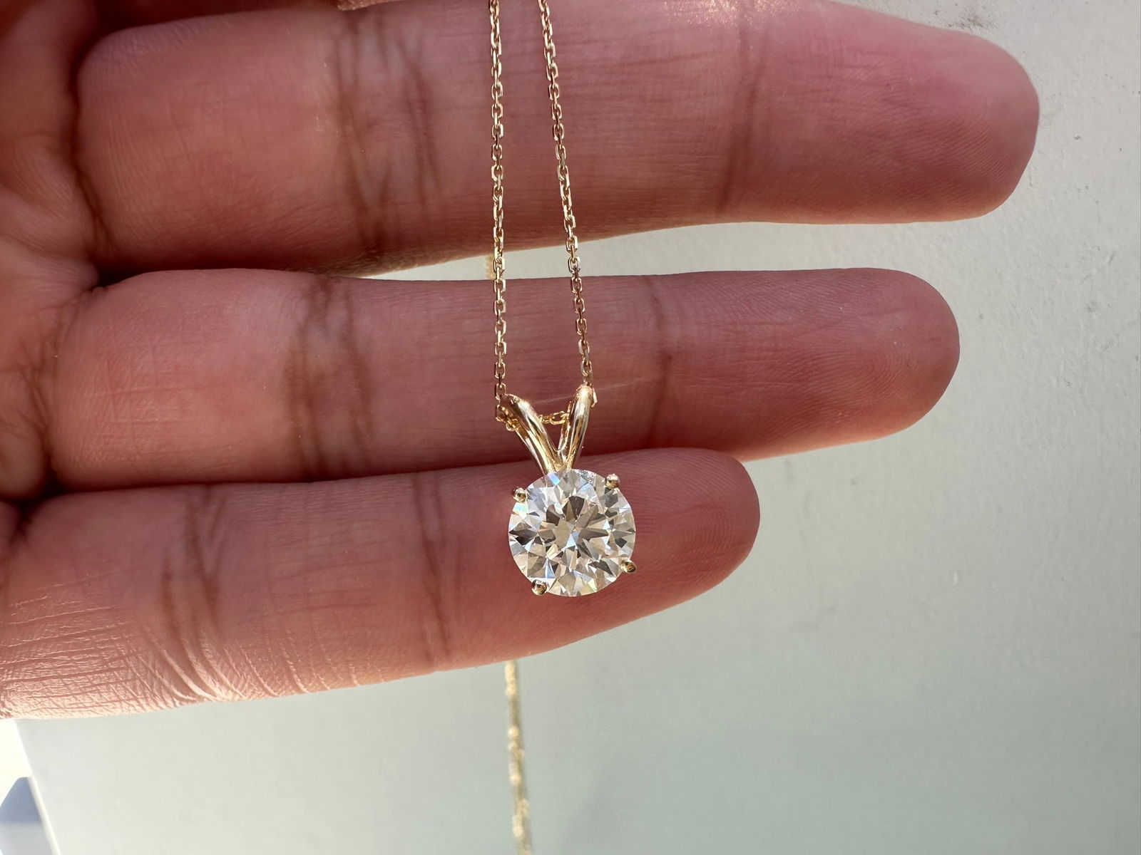 2 Carat Round single stone Diamond Pendant in 14k Yellow Gold: 14k Yellow Gold Round Single Stone Dimond Pendent/Total Diamond Weight : 2 CaratSolid 14k Yellow Gold & Conflict - Free Lab Grown Diamond/Diamond Quality : E in Color & VVS-VS in Clarity/Length : 12 m