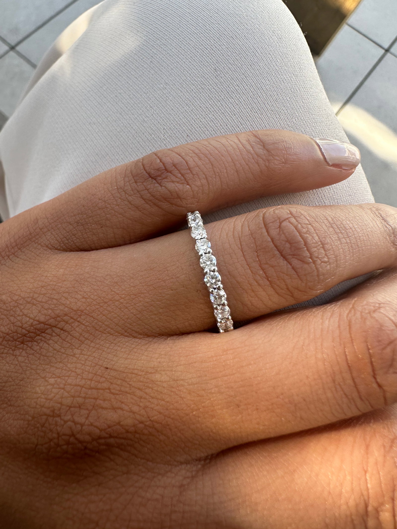 1 Carat Round Diamond Eternity Band in 14k White Gold: 14k White Gold Round Diamond Eternity Band /Total Diamond Weight: 1 Carat Solid 14k White Gold & Conflict - Free Lab Grown Diamond/Diamond Quality : E in Color & VVS-VS in Clarity/Width : 2.3 mmRetail