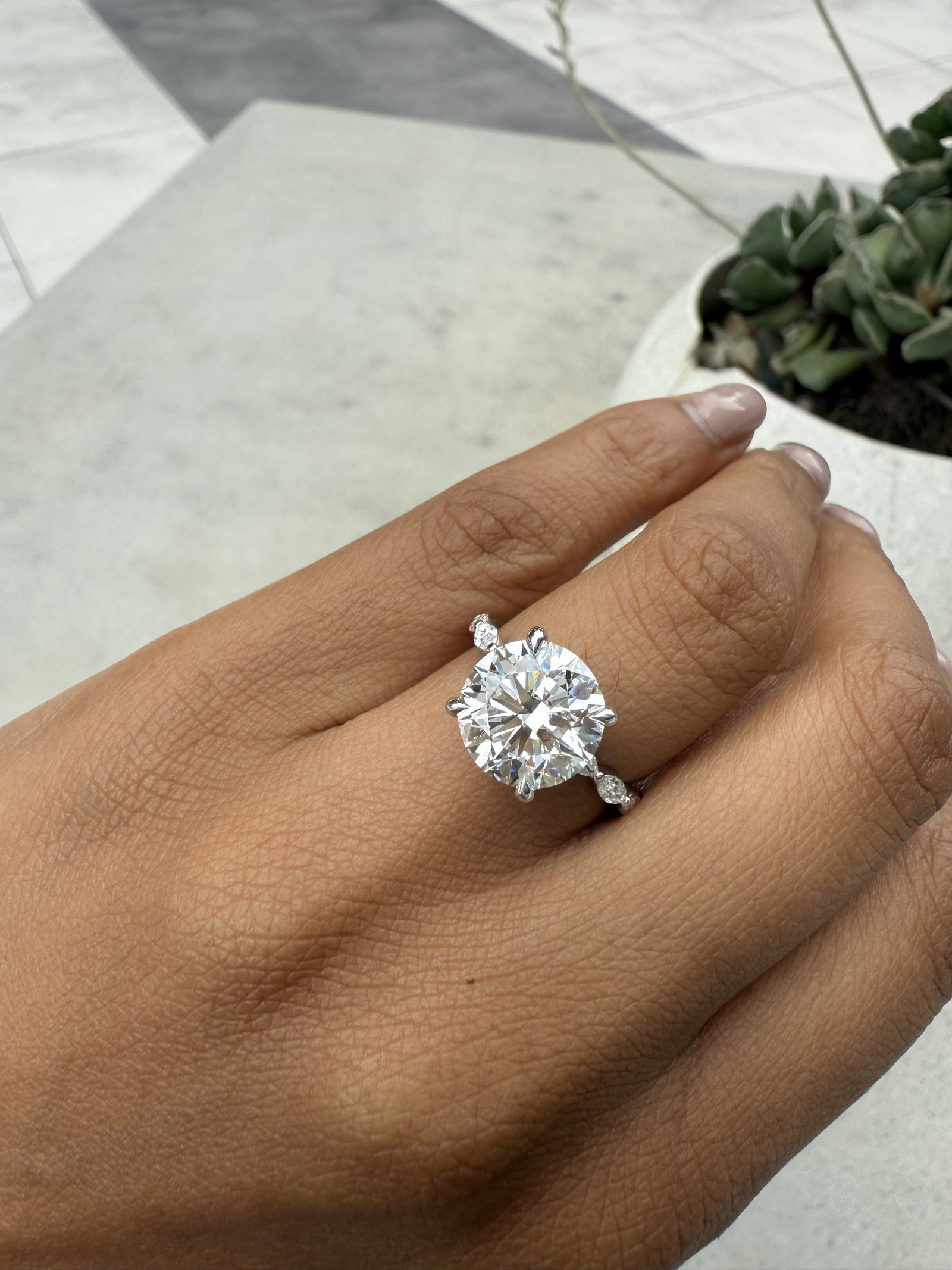 4 Carat Round . Hidden Halo , marquee Side Stone Diamond Engagement Ring in 14k White Gold: 14k White Gold Round hidden halo Marquee Side Stone Diamond Engagemant Ring /Total Diamond Weight: 4 Carat / Center Stone : 4 Carat / Side Stone : 0.5 Carat Solid 14k White Gold & Conflict - Free Lab