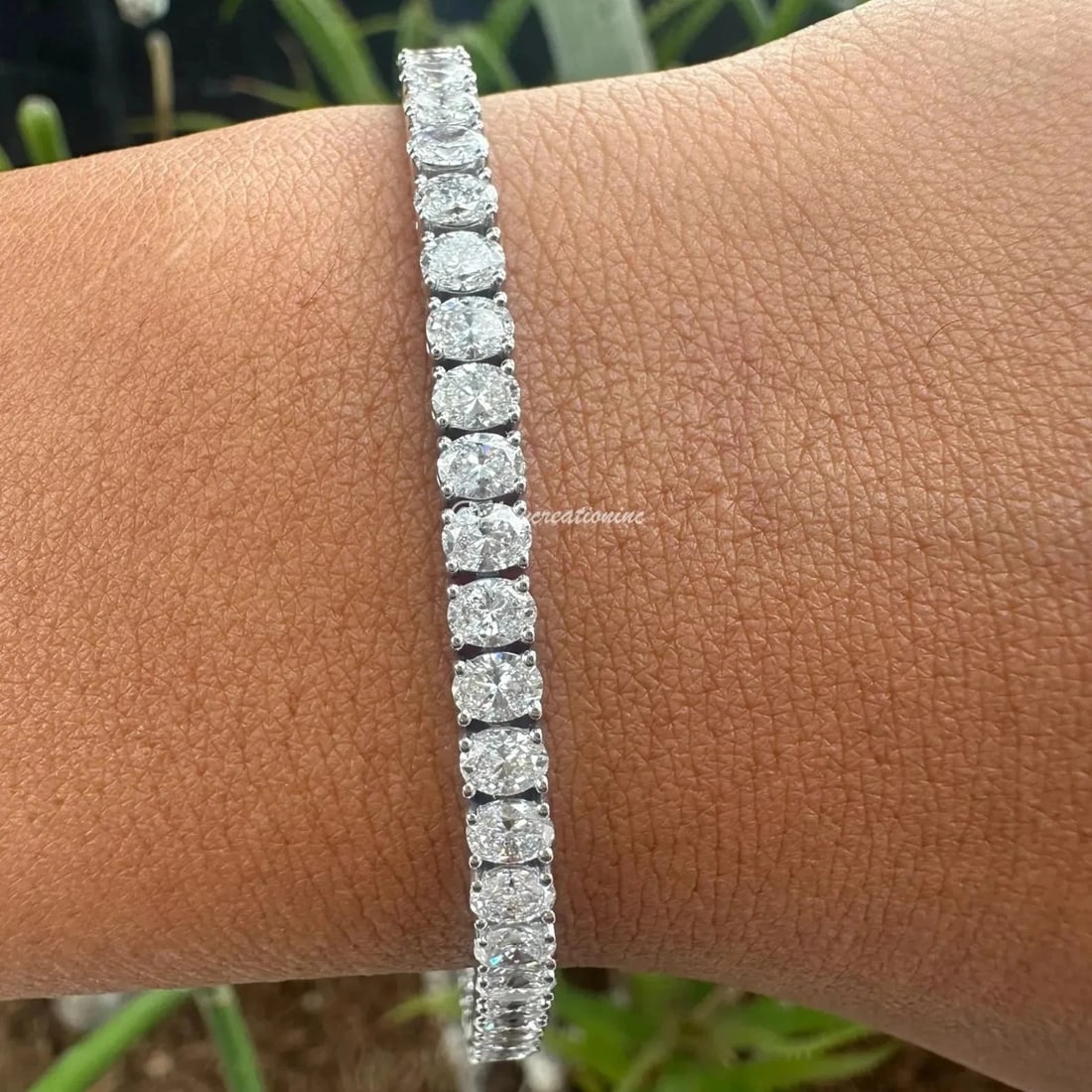 10 Carat Oval Diamond Tennis Bracelet in 14k White Gold: 14k White Gold Oval Diamond Tennis Bracelet/Length of the Bracelet: 7 Inches/Total Diamond Weight: 10 Carat in a 7 inch bracelet/Solid 14K White Gold and Conflict free Lab grown Diamonds/Diamond Quali