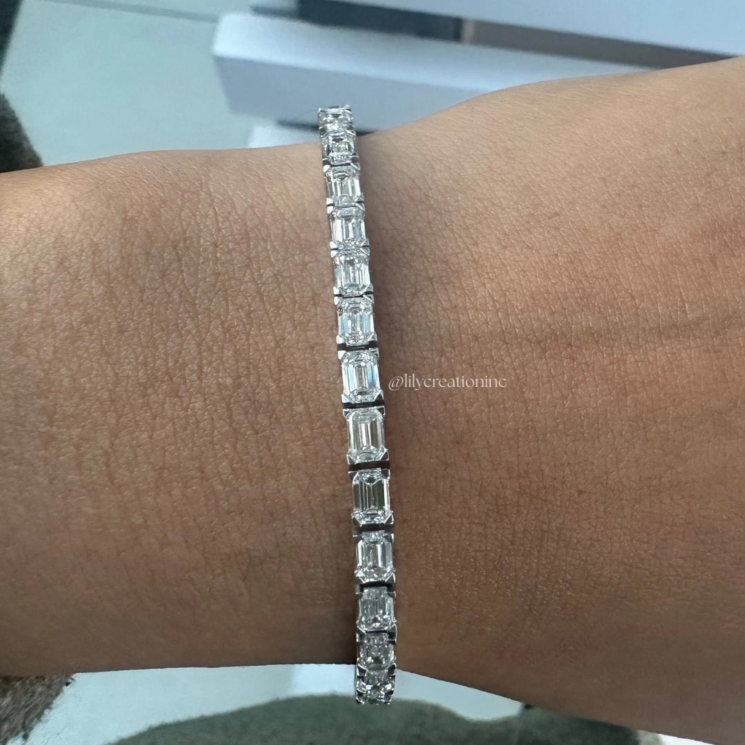 8 Carat Emerald Cut East West Diamond Tennis Bracelet in 14k White Gold: 14k White Gold Emerald Cut East West Diamond Tennis Bracelet/Length of the Bracelet: 7 Inches/Total Diamond Weight: 8 Carat in a 7 inch Bracelet/Solid 14K White Gold and Conflict free Lab grown Diamon