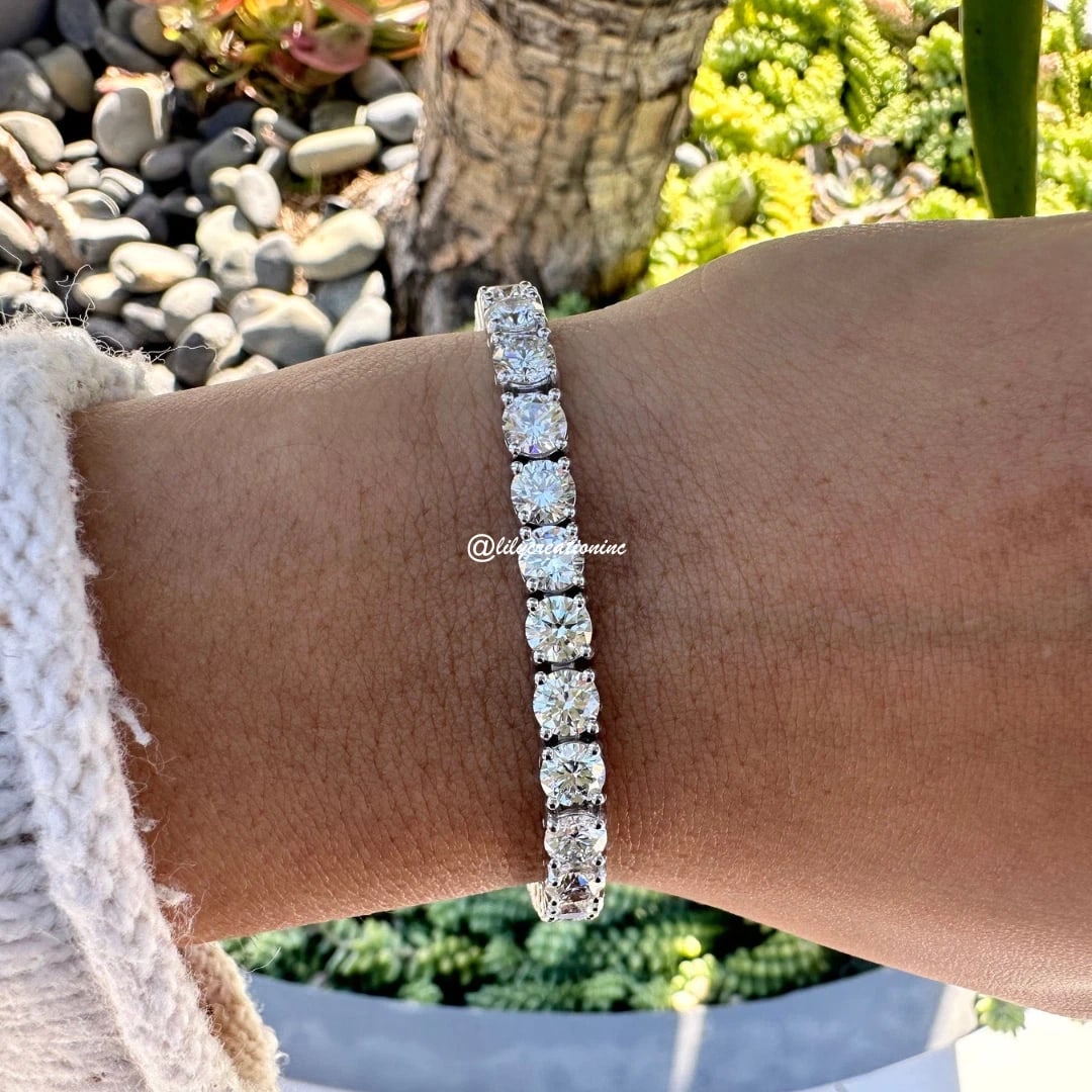 18 Carat Round Diamond Tennis Bracelets in 14k White Gold: 14k White Gold Round Diamond Tennis Bracelet/Length of the Bracelet: 7 Inches/Total Diamond Weight: 18 Carat in a 7 inch Bracelet/Solid 14K White Gold and Conflict free Lab grown Diamonds/Diamond Qual