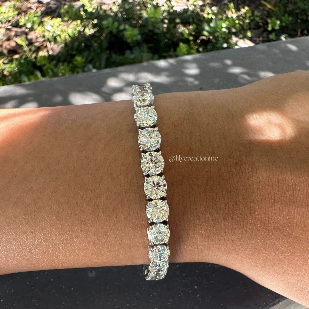 20 Carat Round Diamond Tennis Bracelets in 14k White Gold: 14k White Gold Round Diamond Tennis Bracelet/Length of the Bracelet: 7 Inches/Total Diamond Weight: 20 Carat in a 7 inch Bracelet/Solid 14K White Gold and Conflict free Lab grown Diamonds/Diamond Qual
