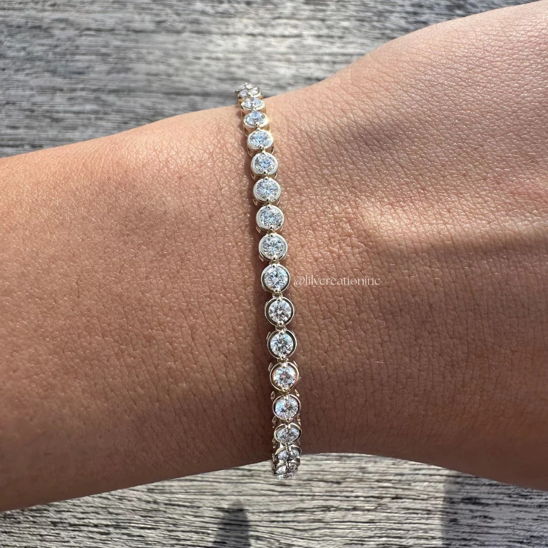 3 Carat Bezel Setting Round Diamond Tennis Bracelet in 14k White Gold: 14k White Gold Bezel Setting Round Diamond Tennis Bracelet/Length of the Bracelet: 7 Inches/Total Diamond Weight: 3 Carat in a 7 inch Bracelet/Solid 14K White Gold and Conflict free Lab grown Diamonds