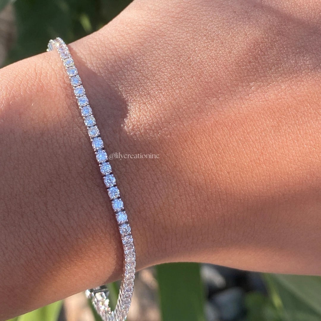 3 Carat Round Diamond Tennis Bracelets in 14k White Gold: 14k White Gold Round Diamond Tennis Bracelet/Length of the Bracelet: 7 Inches/Total Diamond Weight: 3 Carat in a 7 inch Bracelet/Solid 14K White Gold and Conflict free Lab grown Diamonds/Diamond Quali