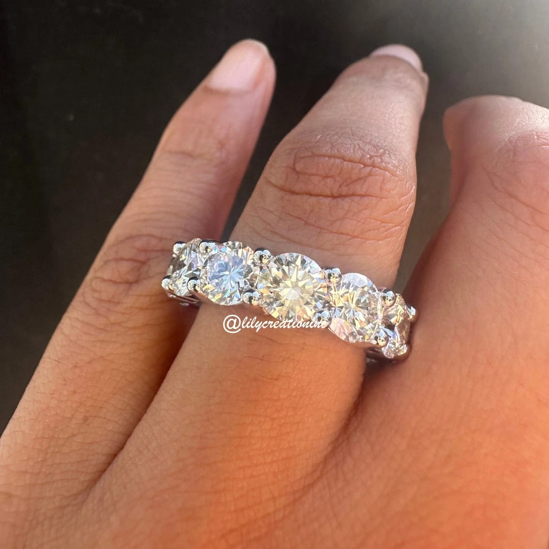 12 Carat Round Diamond Eternity Band in 14k White Gold: 14k White Gold Round Diamond Eternity Band /Total Diamond Weight: 12 Carat Solid 14k White Gold & Conflict - Free Lab Grown Diamond/Diamond Quality : E in Color & VVS-VS in Clarity/Width : 6.5 mmRetai