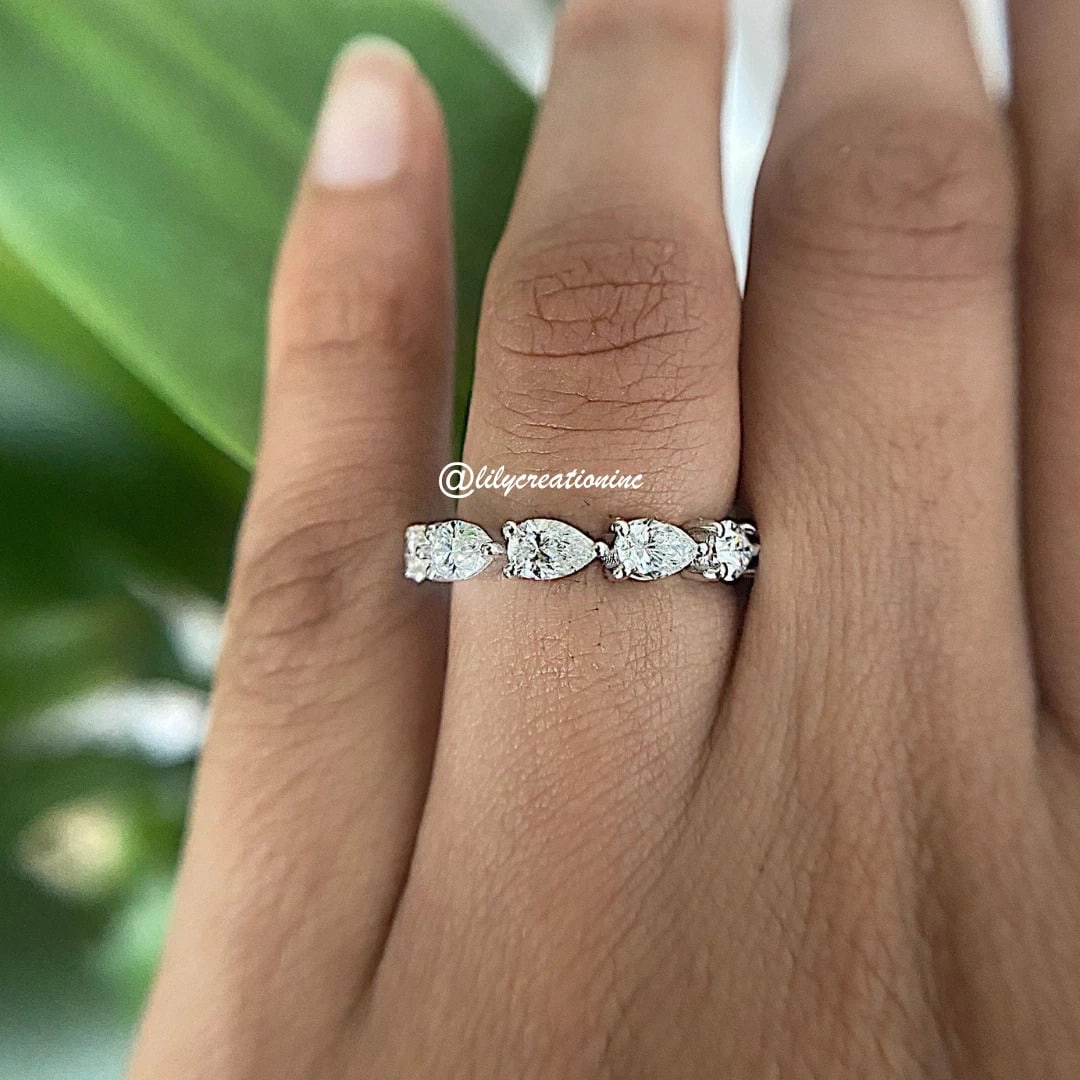 2.5 Carat Pear Diamond Eternity Band in 14k White Gold: 14k White Gold Pear Diamond Eternity Band /Total Diamond Weight: 2.50 Carat Solid 14k White Gold & Conflict - Free Lab Grown Diamond/Diamond Quality : E in Color & VVS-VS in Clarity/Width : 3.5 mmReta