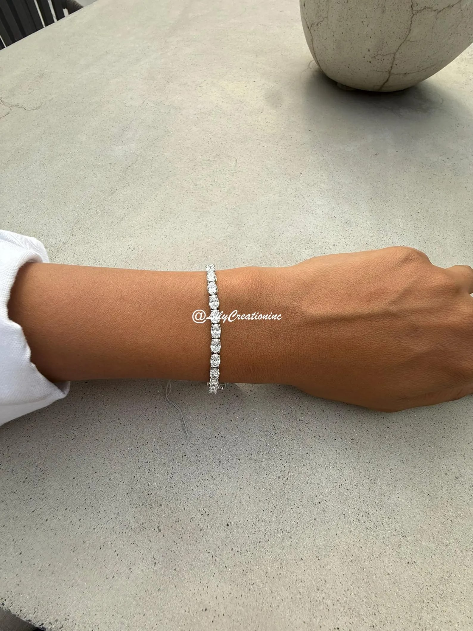 10 Carat Oval East to West Diamond Tennis Bracelet in 14k White Gold: 14k White Gold Oval East and West Diamond Tennis Bracelet/Length of the Bracelet: 7 Inches/Total Diamond Weight: 10 Carat in a 7 inch Bracelet/Solid 14K White Gold and Conflict free Lab grown Diamonds