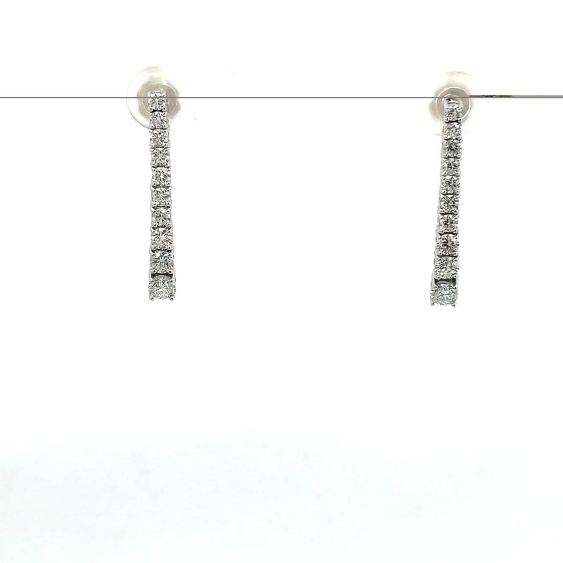 1 Carat Round Diamond Graduated Huggie Earrings in 14k White Gold: 14k White Gold Round Graduated Diamond Huggie Earring /Total Diamond Weight : 1 Carat Solid 14K White Gold & Conflict-Free Lab-Grown Diamonds?Diamond Quality : E In Color & VVS-VS In Clarity/Width : m