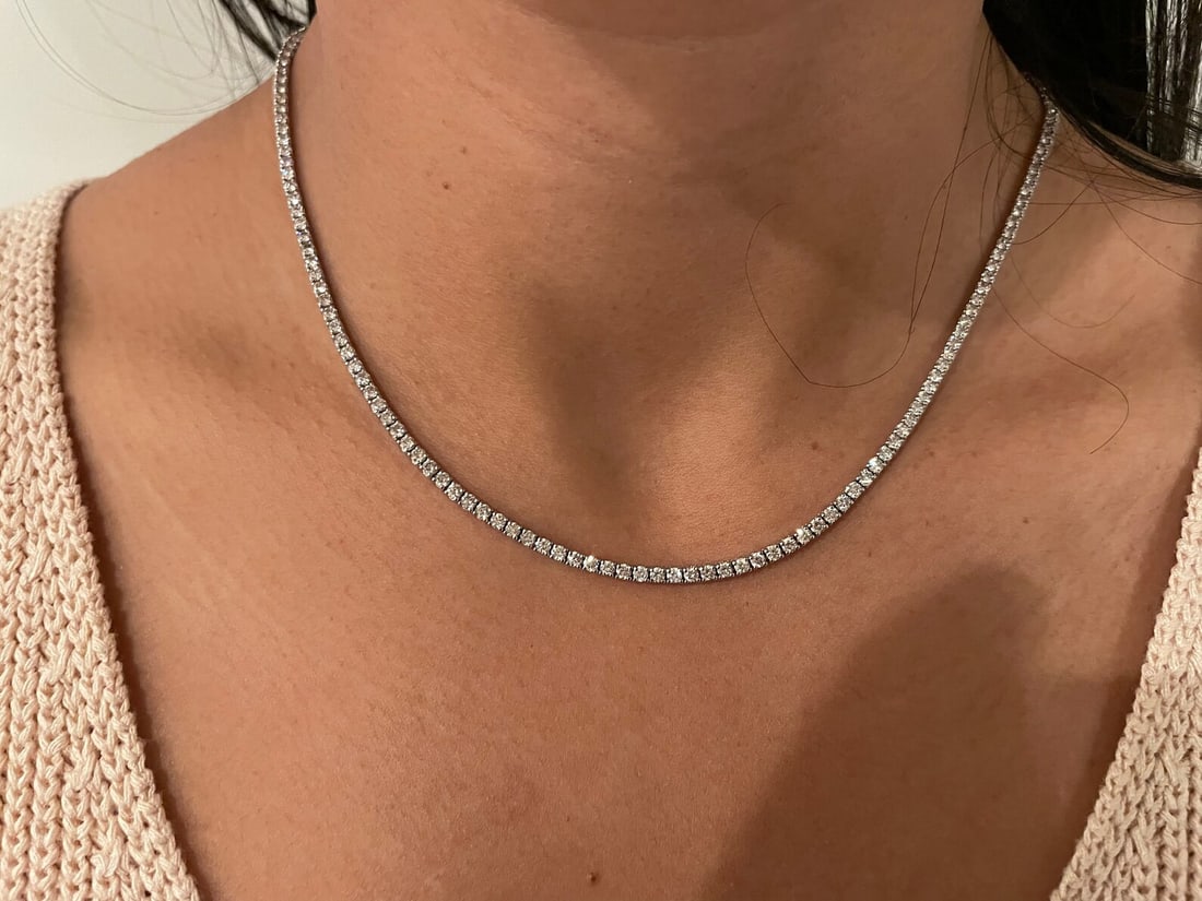 6 Carat Round Diamond Tennis Necklace in 14k White Gold: 14k White Gold Round Diamond Tennis Necklace /Length of the Necklace : 18 InchesTotal Diamond Weight : 6 Carat in a 18 Inch Necklace/Solid 14k White Gold & Conflict - Free Lab Grown Diamond/Diamond Qu