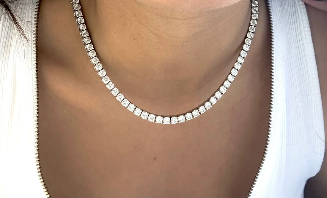 25 Carat Round Straight Line Diamond Tennis Necklace in 14k White Gold: 14k White Gold Round Straight Line Diamond Tennis Necklace /Length of the Necklace : 18 InchesTotal Diamond Weight : 25 Carat in a 18 Inch Necklace/Solid 14k White Gold & Conflict - Free Lab Grown Dia