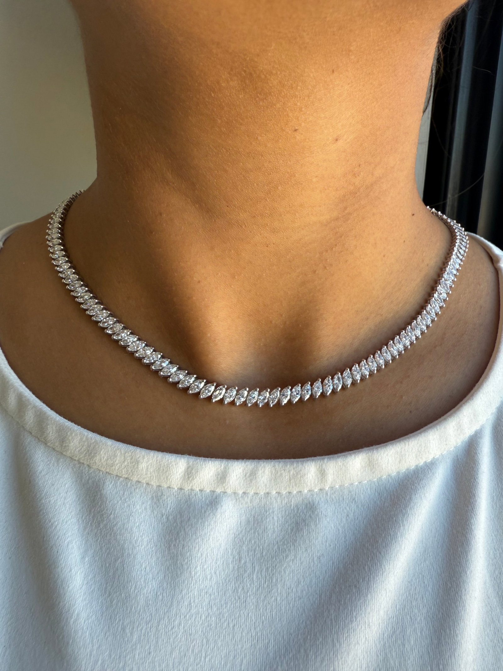 17 Carat Marquise cut Diamond tennis necklace in 14k White Gold: 14k White Gold Marquise Cut Diamond Tennis Necklace /Length of the Necklace : 18 Inches/Total Diamond Weight : 17 Carat in a 18 Inch Necklace/Solid 14k White Gold & Conflict - Free Lab Grown Diamond/D