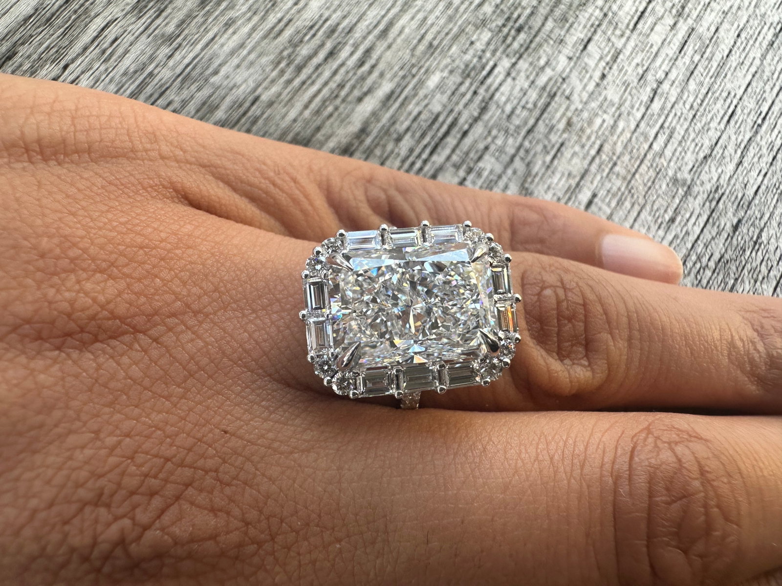 7 Carat Radiant cut Diamond engagement ring with baguette & round side stones in 14k White Gold: 14k White Gold Radiant Cut Diamond Engagement Ring with Baguette & round side stones /Total Diamond Weight: 8 Carat / Center Stone is 7 Carat / Side Stone is 1 Carat Solid 14k White Gold & Conflict - 