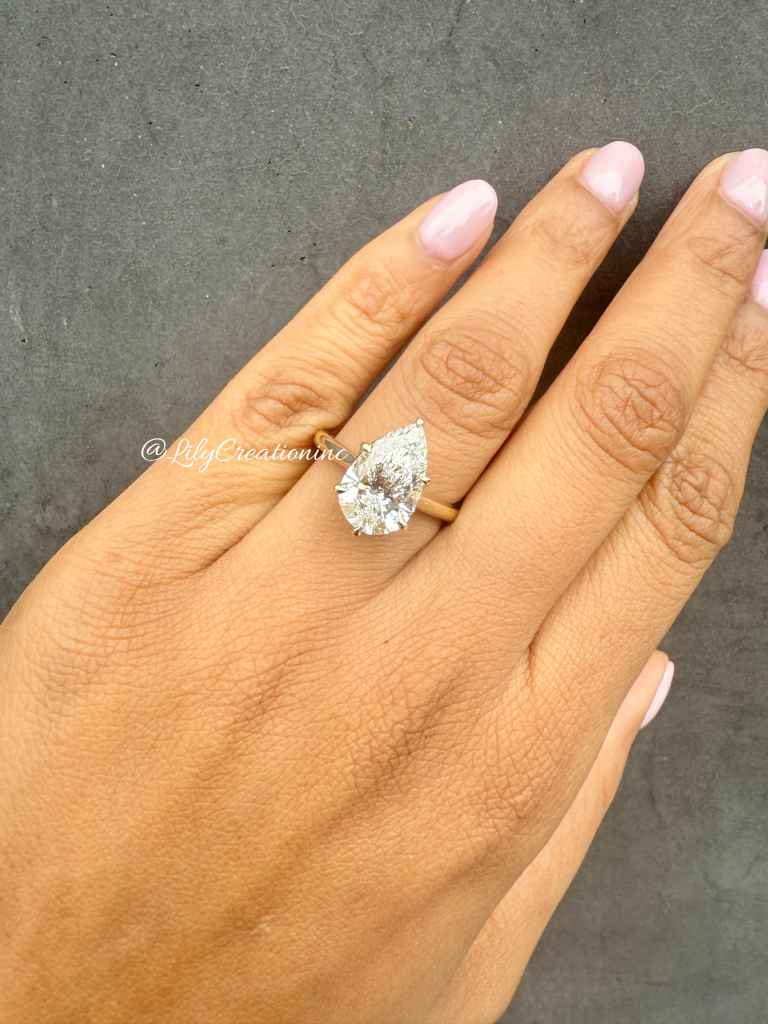 3 Carat Pear Cut Diamond Engagament Ring in14k Yellow Gold: 14k Yellow Gold Pear Cut Diamond Engagement Ring /Total Diamond Weight: 3 Carat Solid 14k Yellow Gold & Conflict - Free Lab Grown Diamond/Diamond Quality : E in Color & VVS-VS in Clarity/Certification