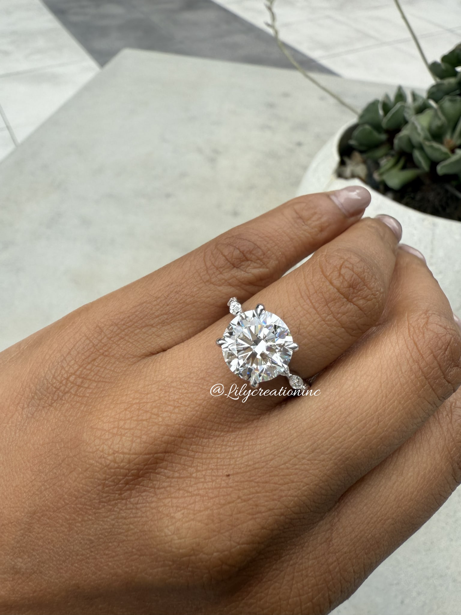 4 Carat Round . Hidden Halo , marquee Side Stone Diamond Engagement Ring in 14k White Gold: 14k White Gold Round hidden halo Marquee Side Stone Diamond Engagemant Ring /Total Diamond Weight: 4 Carat / Center Stone : 4 Carat / Side Stone : 0.5 Carat Solid 14k White Gold & Conflict - Free Lab 
