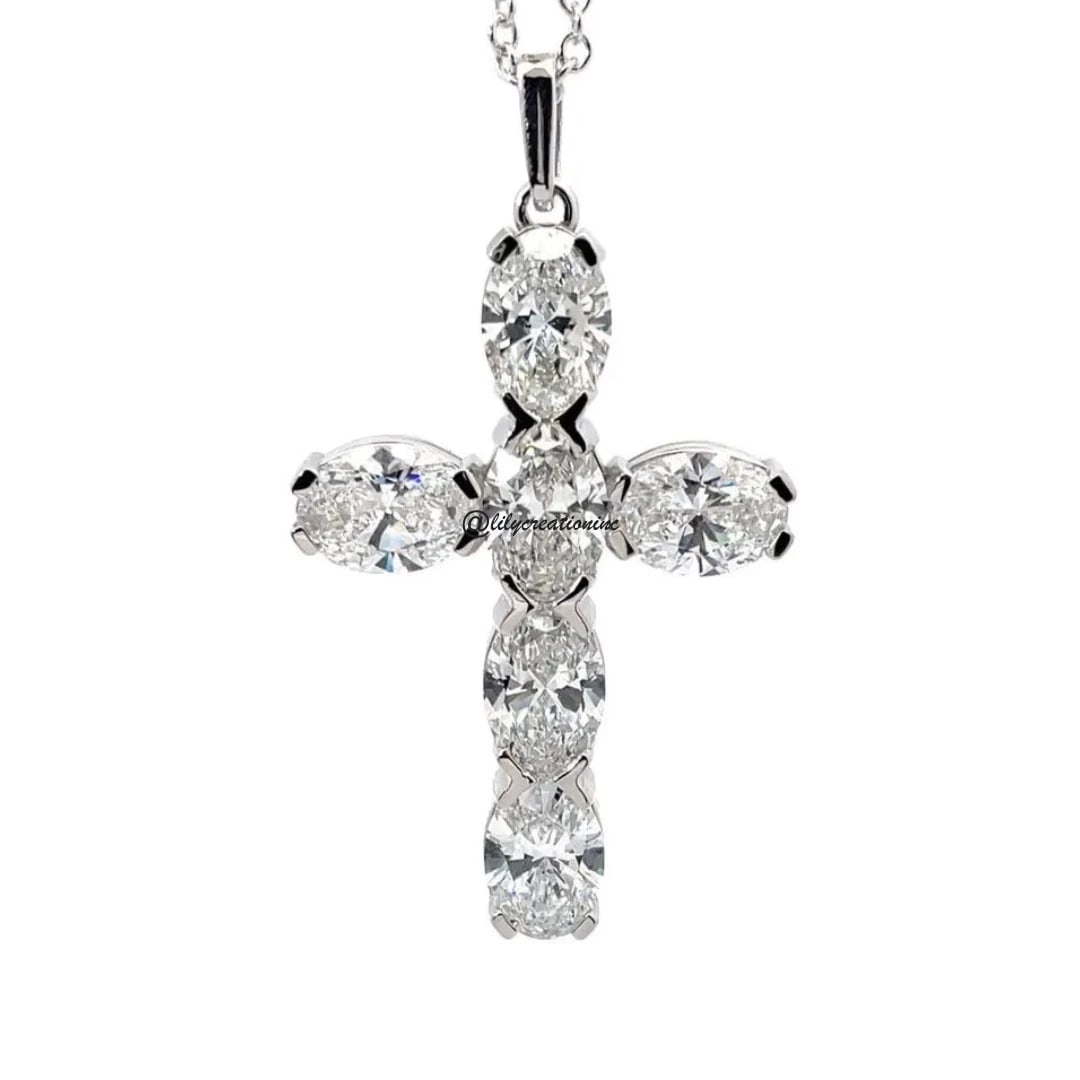 6 Carat 6 Stone Oval Diamond Cross Pendant in 14k White Gold: 14k White Gold 6 Stone Oval Diamond Cross Pendent /Length of the Pendant : 35mmTotal Diamond Weight : 6 Carat Solid 14k White Gold & Conflict - Free Lab Grown Diamond/Diamond Quality : E in Color & VV