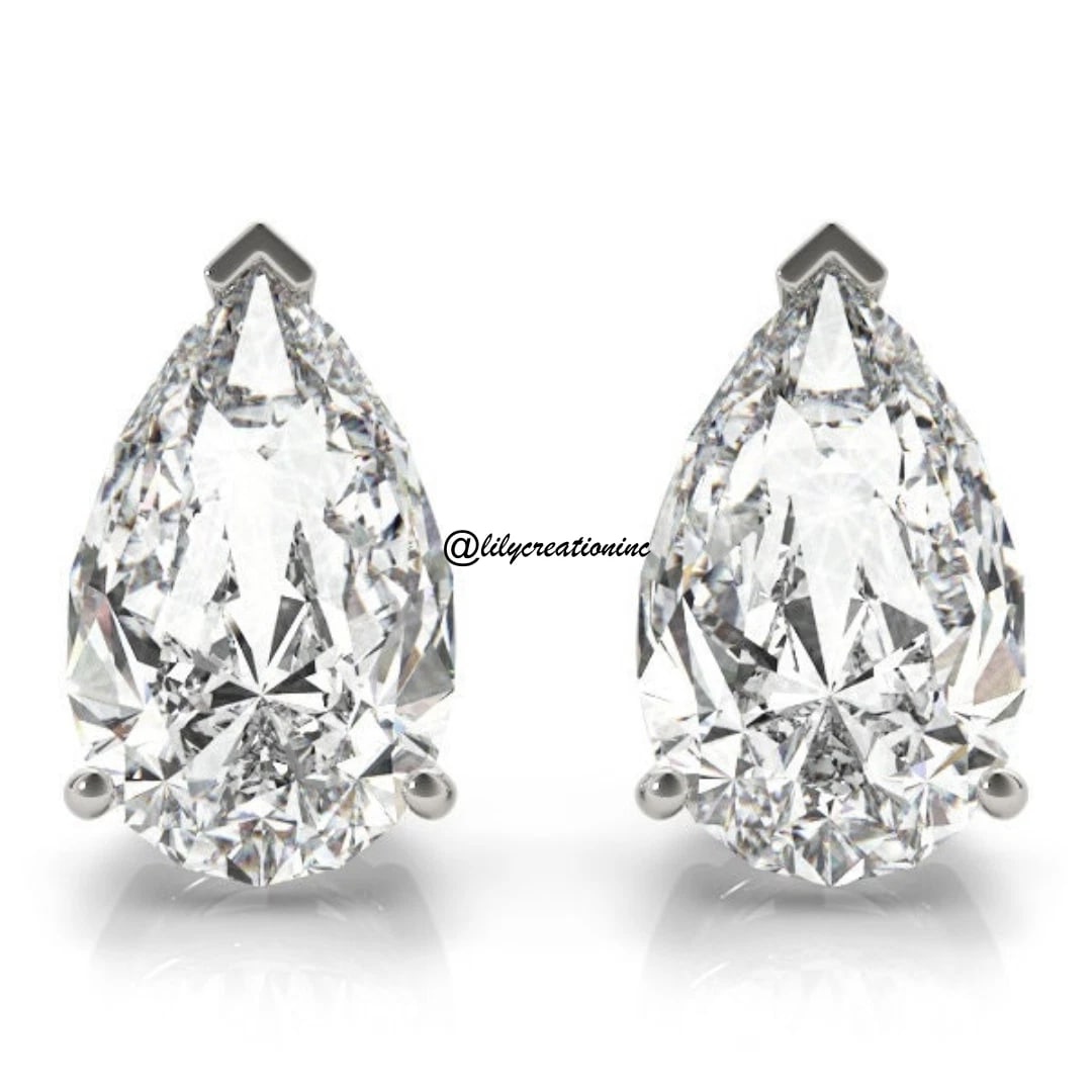 2 Carat Pear Diamond Stud Earring in 14k White Gold: 14k White Gold Pear Diamond Stud Earrings/Total Diamond Weight: 2 CaratSolid 14K White Gold and Conflict free Lab grown Diamonds/Diamond Quality: E In Color & VVS-VS In Clarity/Width : mmBacking : Pus