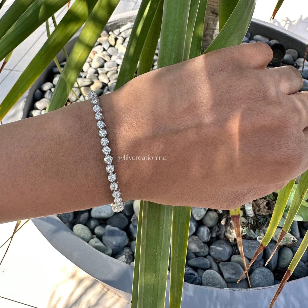 4 Carat Crown Setting Round Diamond Tennis Bracelet in 14k White Gold: 14k White Gold Crown Setting Round Diamond Tennis Bracelet/Length of the Bracelet: 7 Inches/Total Diamond Weight: 4 Carat in a 7 inch Bracelet/Solid 14K White Gold and Conflict free Lab grown Diamonds
