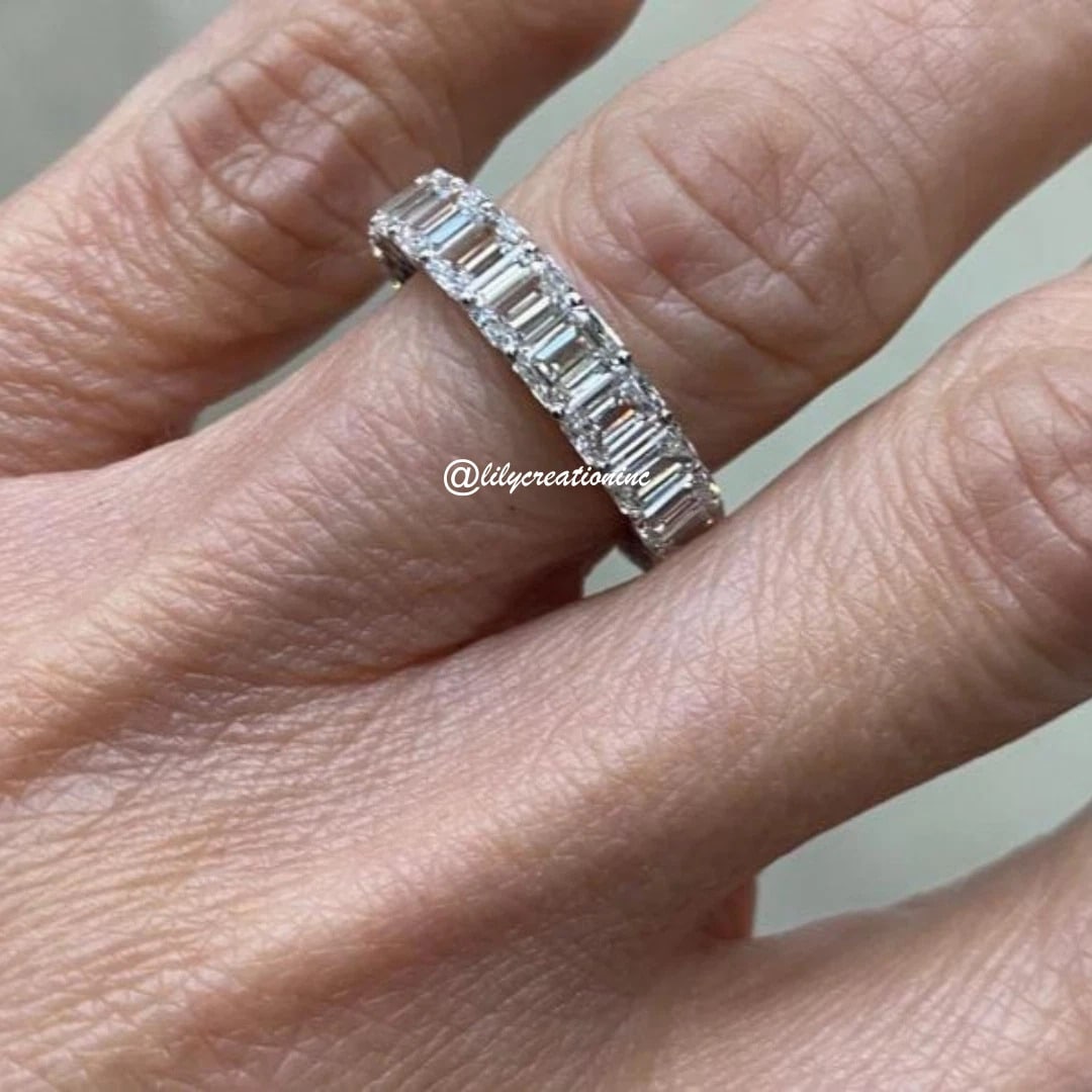 7 Carat Emerald Cut Diamond Eternity Band in 14k White Gold: 14k White Gold Emerald Cut Diamond Eternity Band /Total Diamond Weight: 7 Carat Solid 14k White Gold & Conflict - Free Lab Grown Diamond/Diamond Quality : E in Color & VVS-VS in Clarity/Width : 5mmRet