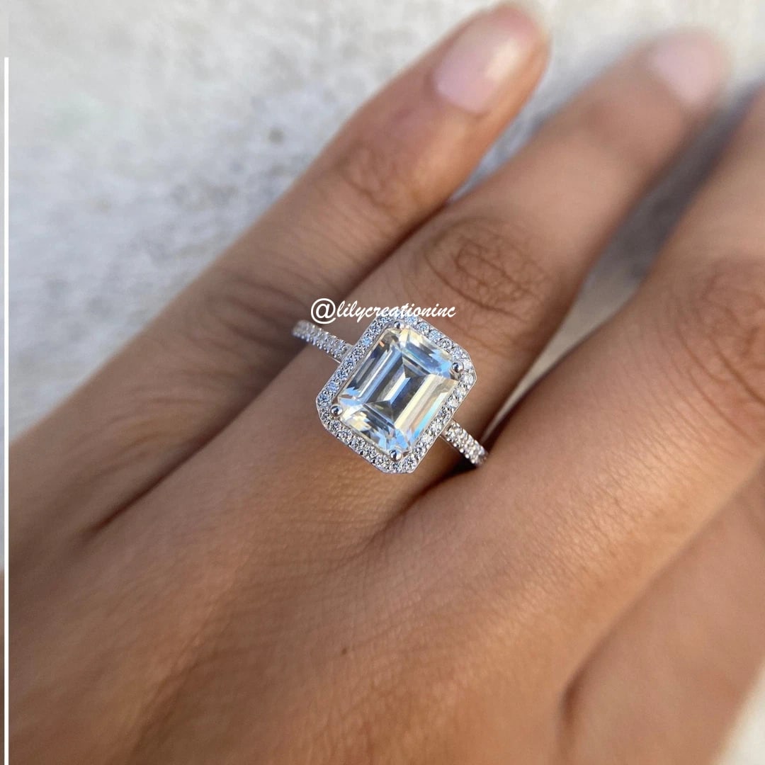 3 Carat Emerald Cut Halo Diamond Engagement Ring in 14k White Gold: 14k White Gold Emerald Cut Halo Diamond Engagement Ring /Total Diamond Weight: 3 Carat / Center Stone: 2 Carat / Side Stone : 1/3 Carat Solid 14k White Gold & Conflict - Free Lab Grown Diamond/Diamond