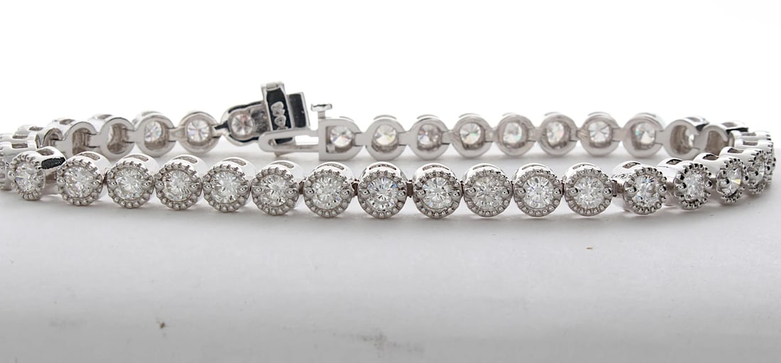 5 Carat Round Vintage Milgrain Bezel Diamond Tennis Bracelet in 14k White Gold: 14k White Gold Vintage Milgrain Bezel Diamond Tennis Bracelet/Length of the Bracelet: 7 Inches/Total Diamond Weight: 5 Carat in a 7 inch Bracelet/Solid 14K White Gold and Conflict free Lab grown Diamo