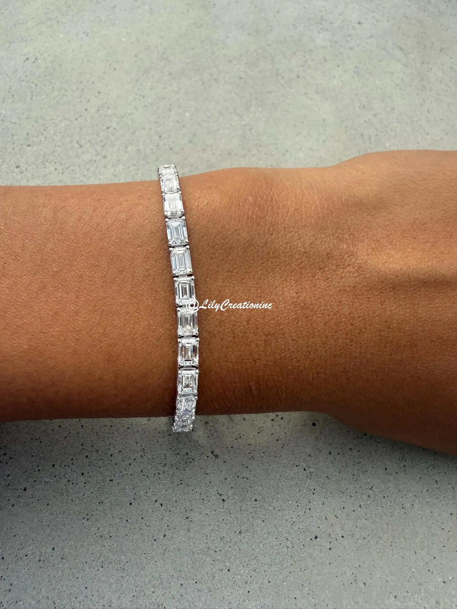 12 Carat Emerald East to West Diamond Tennis Bracelet in 14k White Gold: 14k White Gold Emerald East to West Diamond Tennis Bracelet/Length of the Bracelet: 7 Inches/Total Diamond Weight: 12 Carat in a 7 inch Bracelet/Solid 14K White Gold and Conflict free Lab grown Diamon