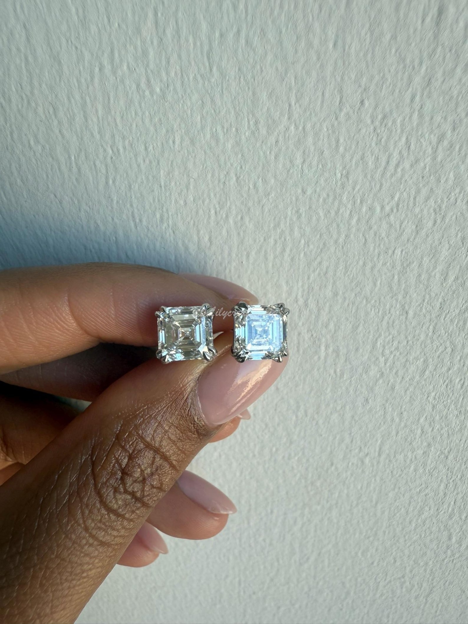 4 Carat Asscher Unique Stud Earrings in 14k White Gold: 14k White Gold Asscher Unique Diamond Stud Earrings/Total Diamond Weight: 4 CaratSolid 14K White Gold and Conflict free Lab grown Diamonds/Diamond Quality: E In Color & VVS-VS In Clarity/Width : 7 mmB