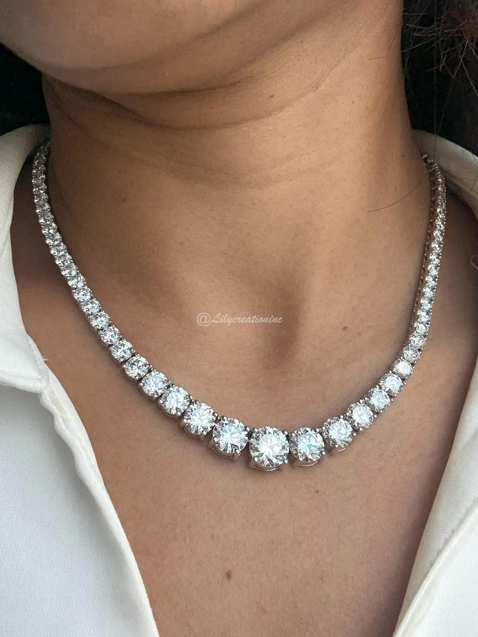 50 Carat Round Graduated Diamond Tennis Necklace in 14k White Gold: 14k White Gold Round Graduated Diamond Tennis Necklace /Length of the Necklace : 18 InchesTotal Diamond Weight : 50 Carat in a 18 Inch Necklace/Solid 14k White Gold & Conflict - Free Lab Grown Diamond