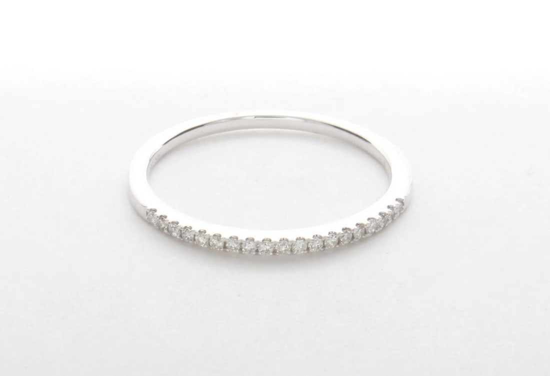 0.10 Carat Round Diamond Eternity Band in 14k White Gold: 14k White Gold Round Diamond Eternity Band /Total Diamond Weight: 0.10 Carat Solid 14k White Gold & Conflict - Free Lab Grown Diamond/Diamond Quality : E in Color & VVS-VS in Clarity/Width : 1.3 mmRet