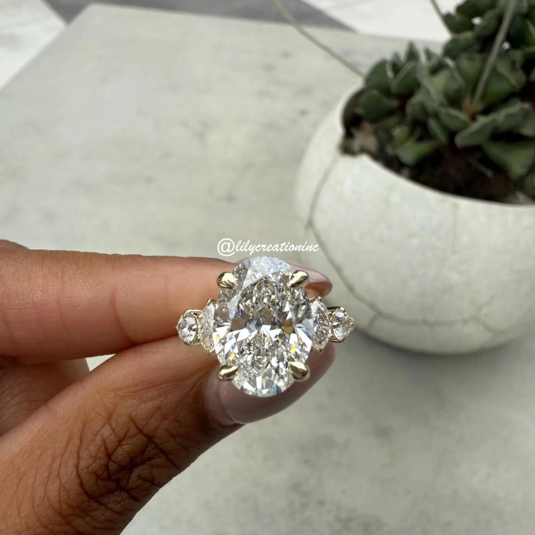 5 Carat Oval w/ Marquee & Round Side Stones Diamond Engagement Ring in 14k Yellow Gold: 14k Yellow Gold Oval Vintage Art Deco Diamond Engagement Ring /Total Diamond Weight: 5 Carat / Center Stone : 5 Carat / Side Stone : 1/2 Carat Solid 14k Yellow Gold & Conflict - Free Lab Grown Diamond