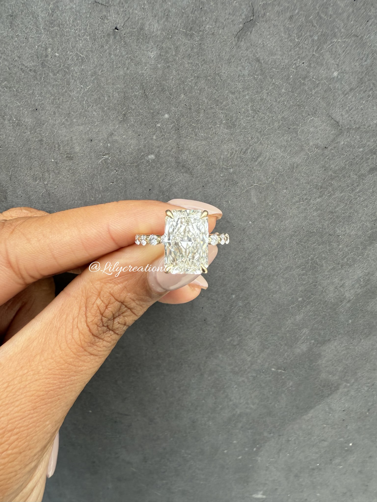 4 Carat Radiant, Round Spaced Diamond Engagement Ring in 14k Yellow Gold: 14k Yellow Gold Radiant & Round Spaced Diamond Engagemant Ring /Total Diamond Weight: 4 Carat ? Center Stone : 4 Carat / Side Stone : 0.40Solid 14k Yellow Gold & Conflict - Free Lab Grown Diamond/Diam
