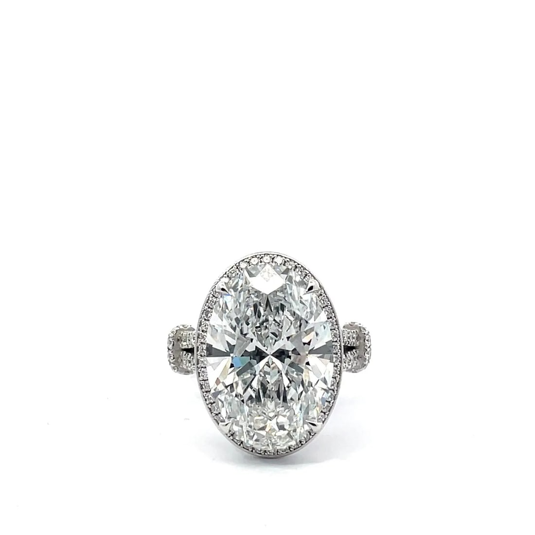 12 Carat Oval Diamond Engagement Ring in 14k White Gold: 14k White Gold Oval Diamond Engagement Ring /Total Diamond Weight: 12 Carat / Center Stone : 12 Carat / Side Stone : 1 Carat totalSolid 14k White Gold & Conflict - Free Lab Grown Diamond/Diamond Quali
