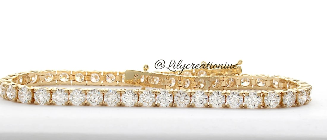 15 Carat Round Diamond Tennis Bracelet in 14k Yellow Gold: 14k Yellow Gold Round Diamond Tennis Bracelet/Length of the Bracelet: 7 Inches/Total Diamond Weight: 15 Carat in a 7 inch Bracelet/Solid 14K Yellow Gold and Conflict free Lab grown Diamonds/Diamond Qu