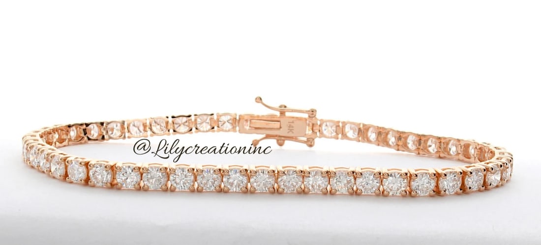 5 Carat Round Diamond Tennis Bracelet in 14k Rose Gold: 14k Rose Gold Round Diamond Tennis Bracelet/Length of the Bracelet: 7 Inches/Total Diamond Weight: 5 Carat in a 7 inch Bracelet/Solid 14K Rose Gold and Conflict free Lab grown Diamonds/Diamond Quality