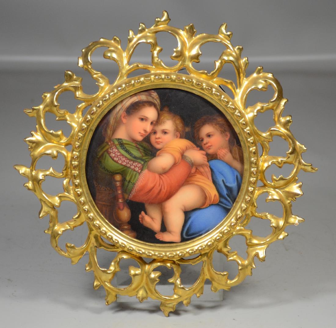 Florentine porcelain plaque after Raphael's Madonna in: Florentine porcelain plaque after Raphael's Madonna in a carved and giltwood frame, old labels on back, marked Firenz, 5 1/2" diameter, overall 10" diameter