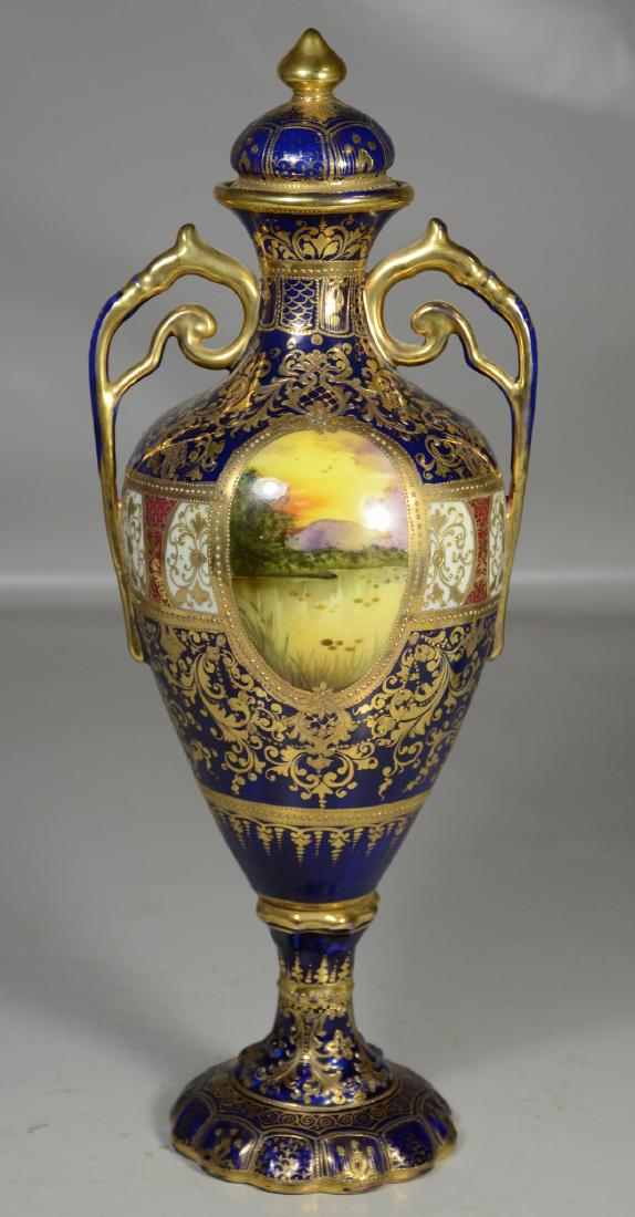 Nippon covered vase with lake reserves with swans,: Nippon covered vase with lake reserves with swans, heavy gilt, spider crack to bolted base, small crack to bottom of lid, 17" h
