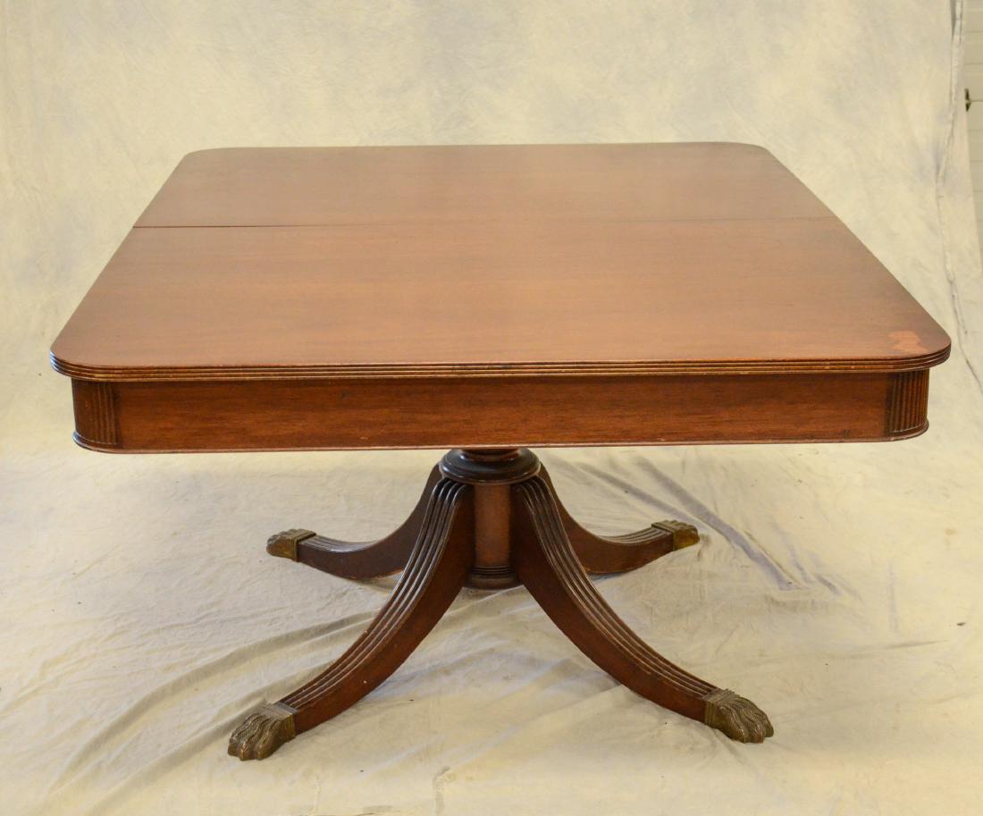 Mahogany Duncan Phyfe style table with 3 leaves, brass: Mahogany Duncan Phyfe style table with 3 leaves, brass paw feet, 60" l x 46" w x 29-1/2" h, leaves 12" each