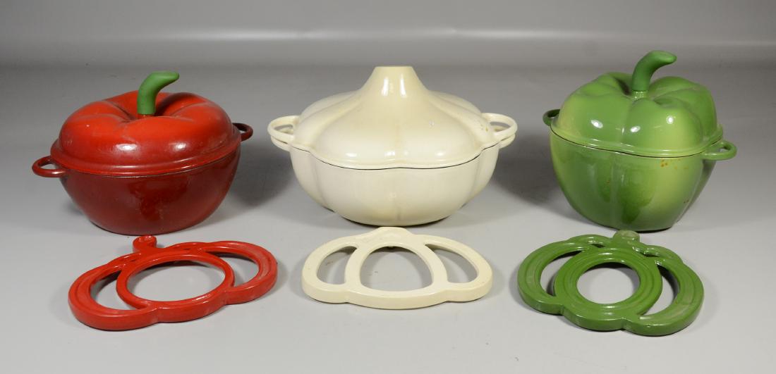 Three Traditions Cast Iron Enamel Casseroles: Three Pieces of Traditions Cast Iron Enamel Vegetable Covered Casseroles, each with trivets, Tomato, Green Pepper and Garlic, largest approx 10" diameter, 8"h