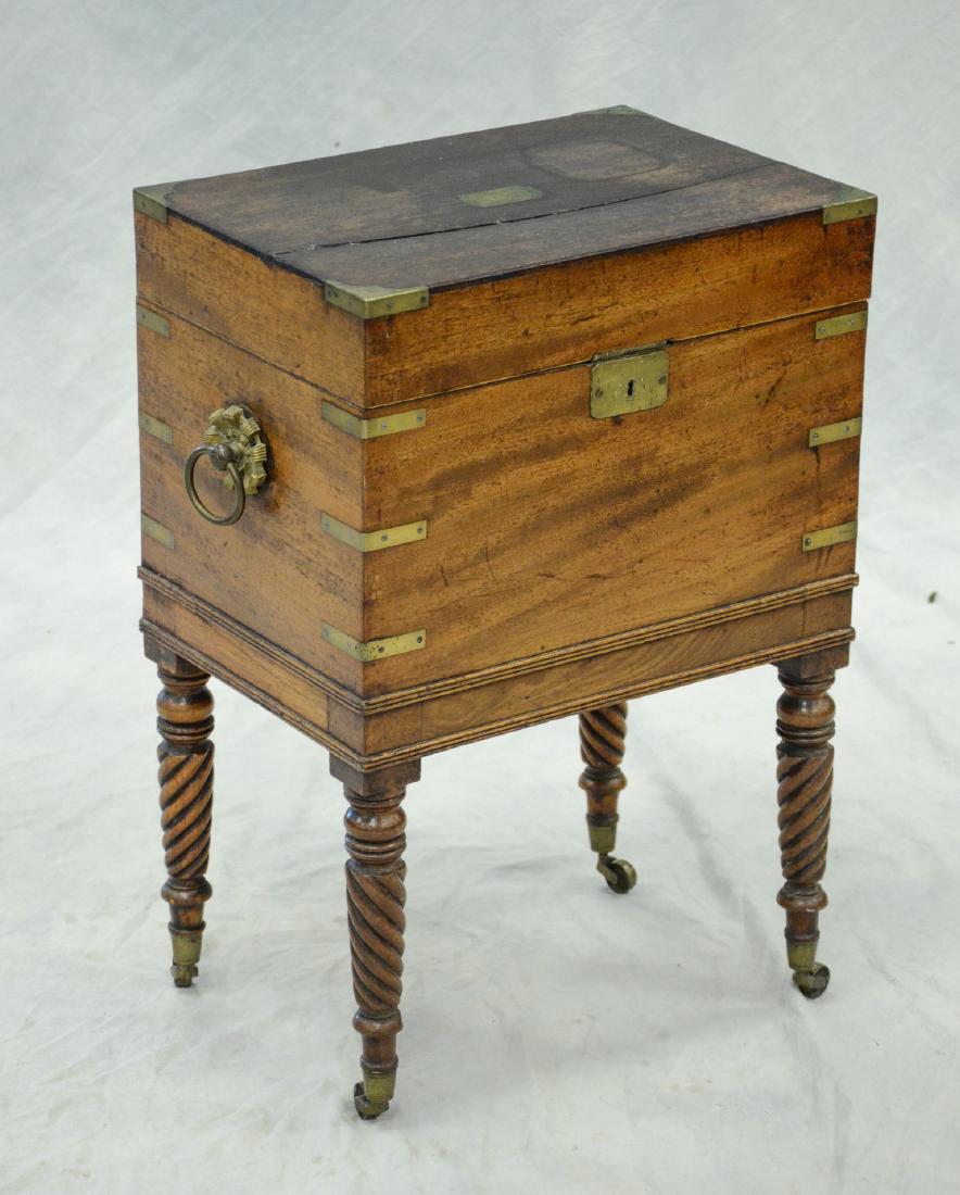 Mahogany brass bound cellerette fitted interior: Mahogany brass bound cellerette interior fitted for 4 bottles & ice, shrinkage cracked top, interior ice compartment not replaced, extensive water damage to top and back, 12" x 17" x 24-3/4" h