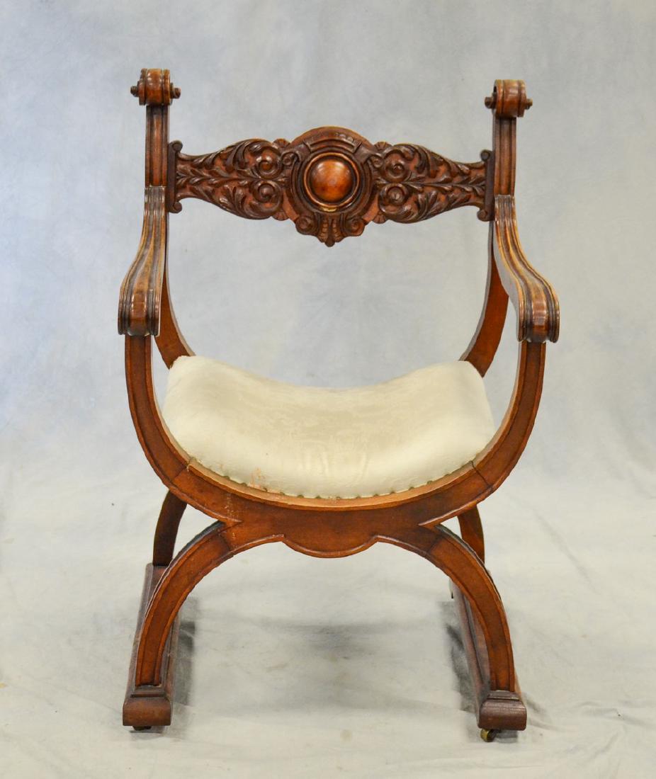 Savonarola hall chair: Savonarola hall chair, carved back, scrolled arms, upholstered seat, 36" h x 24" w