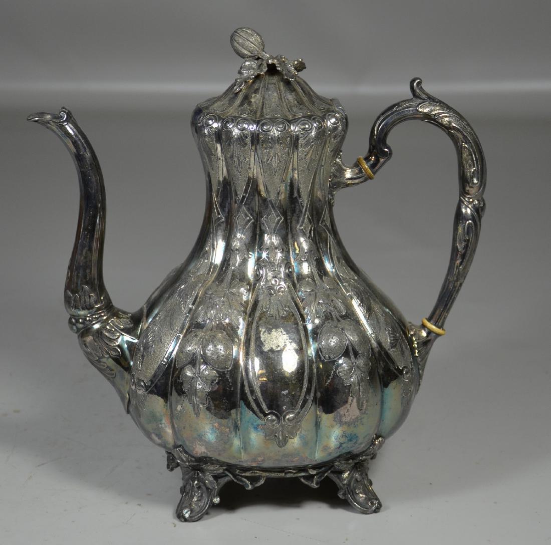 Sheffield silver footed coffee pot: Sheffield silver footed coffee pot with embossed fruit and stylized melon finial, made by Mappin Brothers Sheffield Silver 67 King William Street London, 10-1/4" h