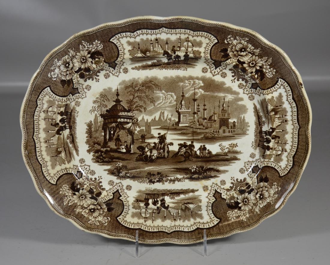 English staffordshire brown decorated platter: English Staffordshire brown decorated platter, "Palestine" impressed Adams, old professional repair to rim, 15" x 12"