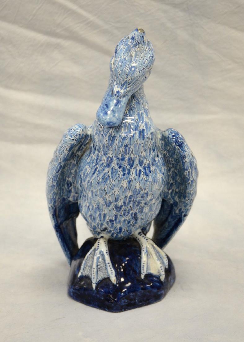 Continental faience bird figure with glaze loss to tail: Continental faience bird figure with glaze loss to tail, broken and repaired wing, 12-1/2" h