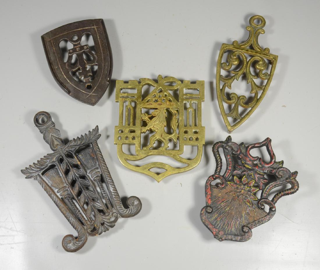 (5) Metal trivets: (5) Metal trivets, 3 iron and 2 brass, longest 8"l